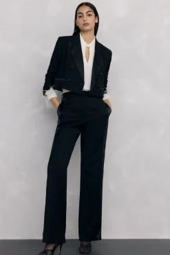 Blusa plumas puño