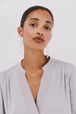 Blusa satinada fluida