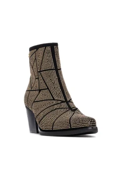 Botín cowboy tachas