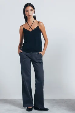 Jeans culotte tachas