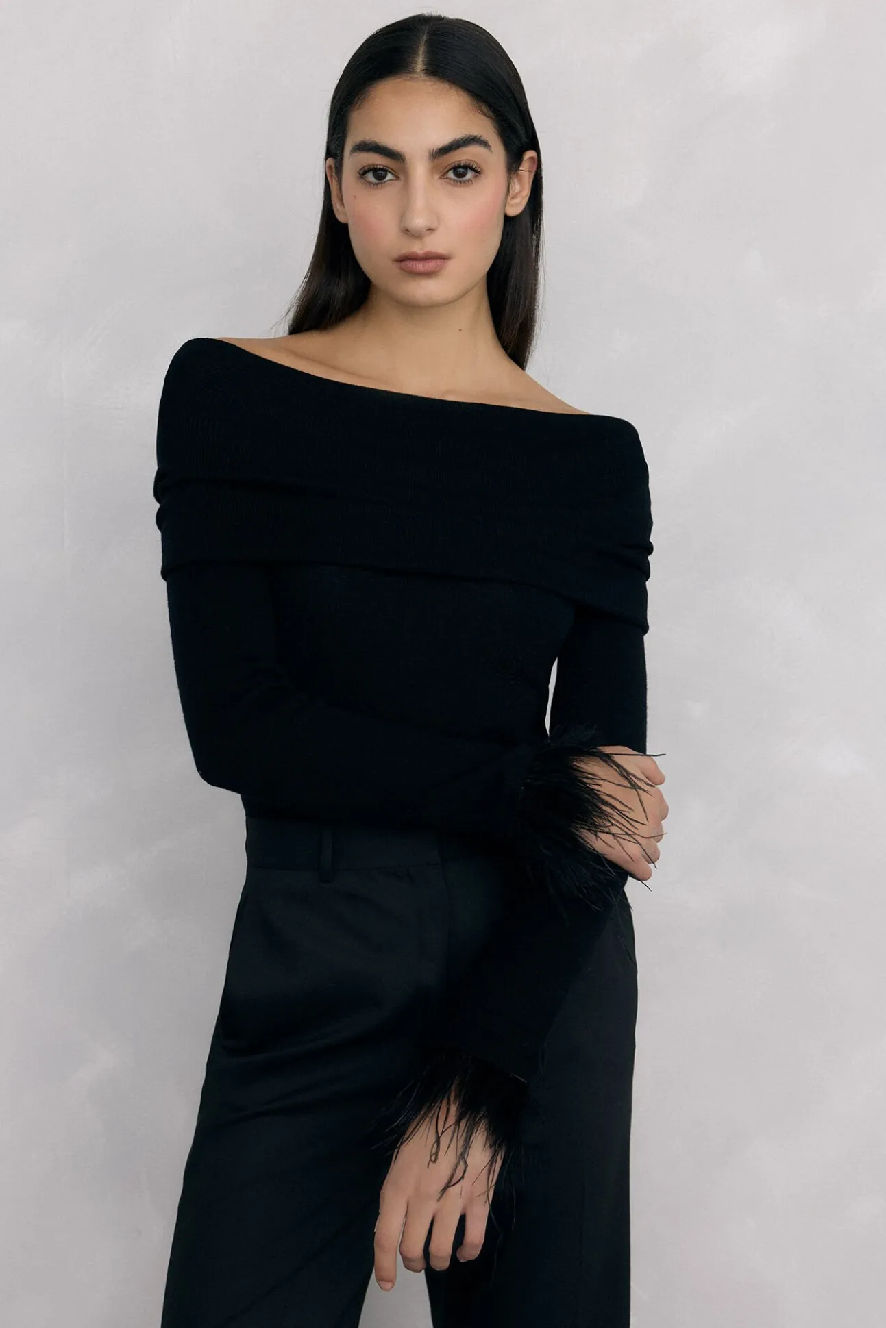 Jersey plumas puño