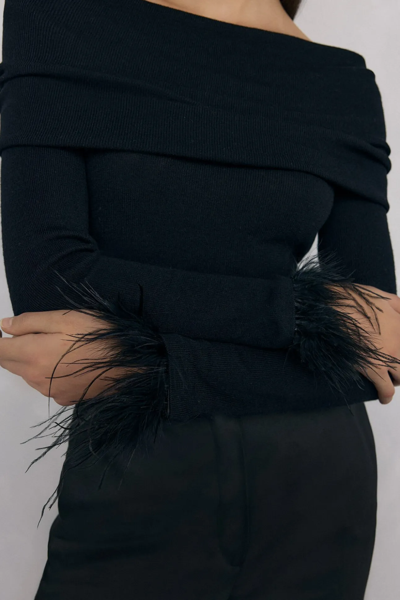 Jersey plumas puño