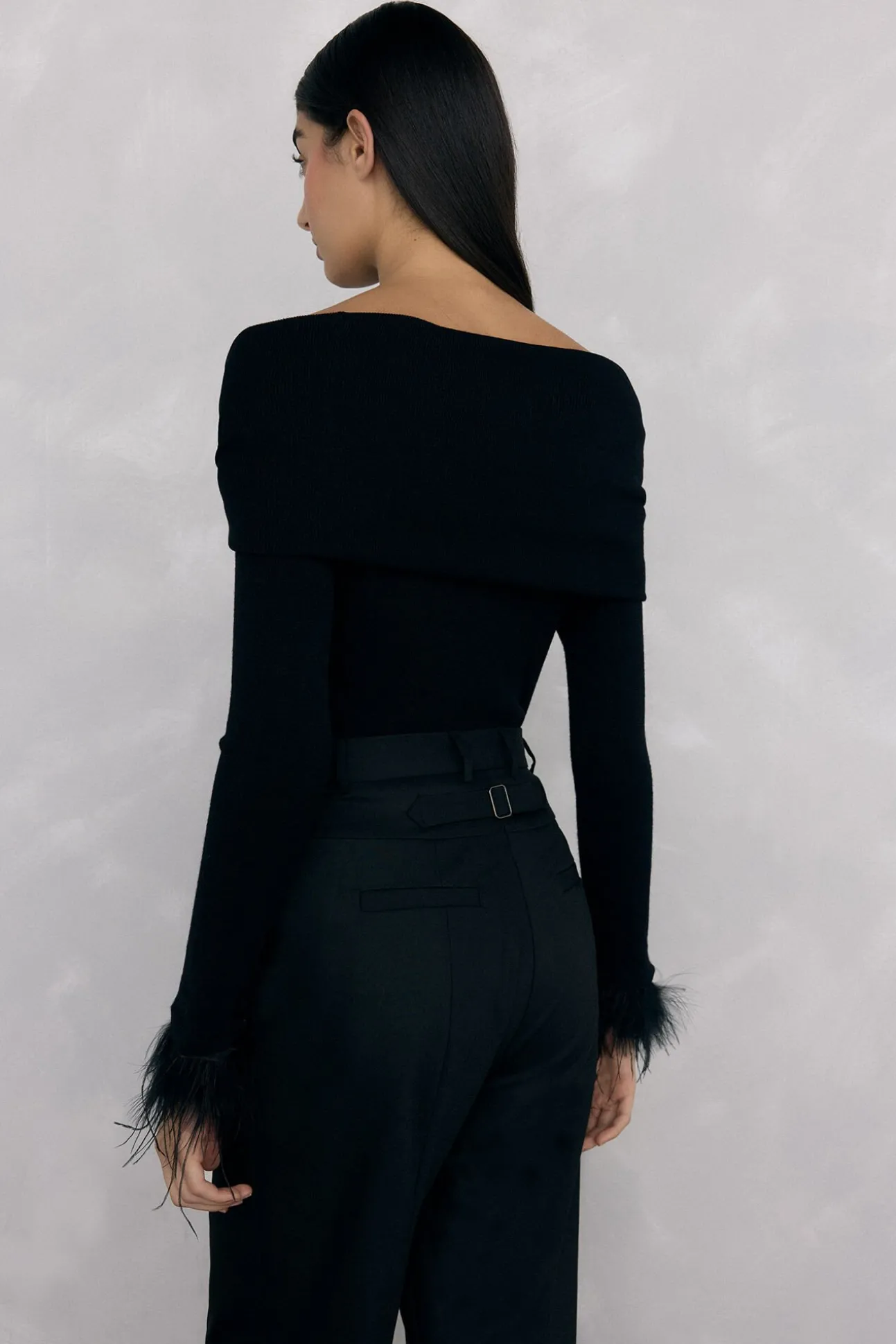 Jersey plumas puño