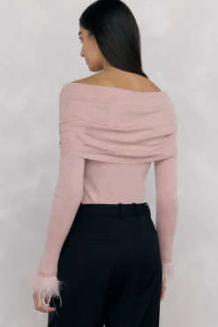 Jersey plumas puño