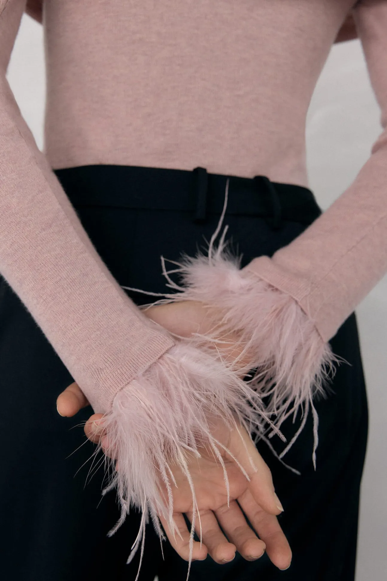 Jersey plumas puño