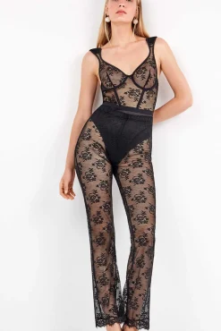 Pantalón largo elástico de encaje floral transparente y delicado