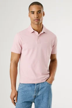 Polo de manga corto con triple botón y logo en el pecho
