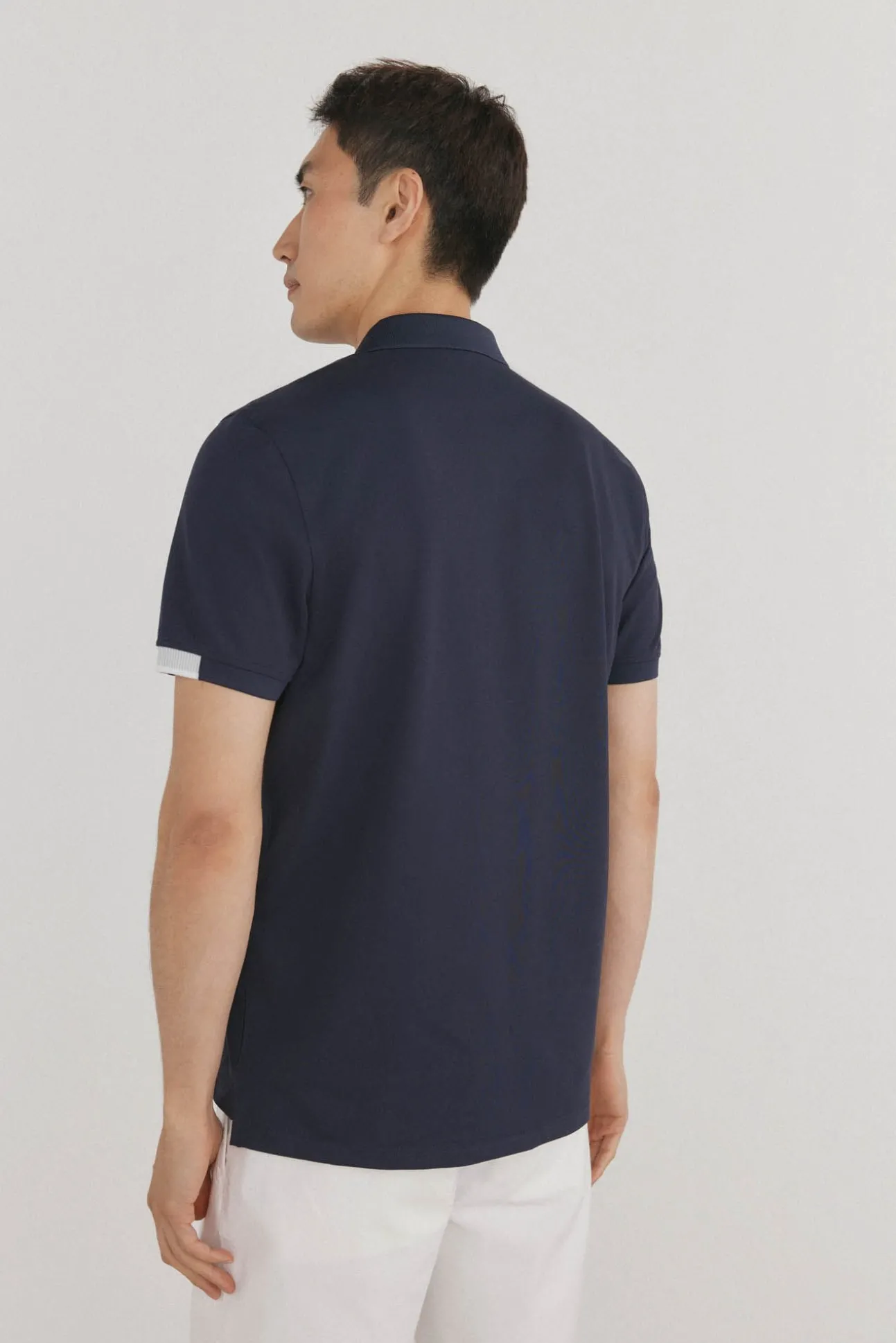 Polo puños contraste