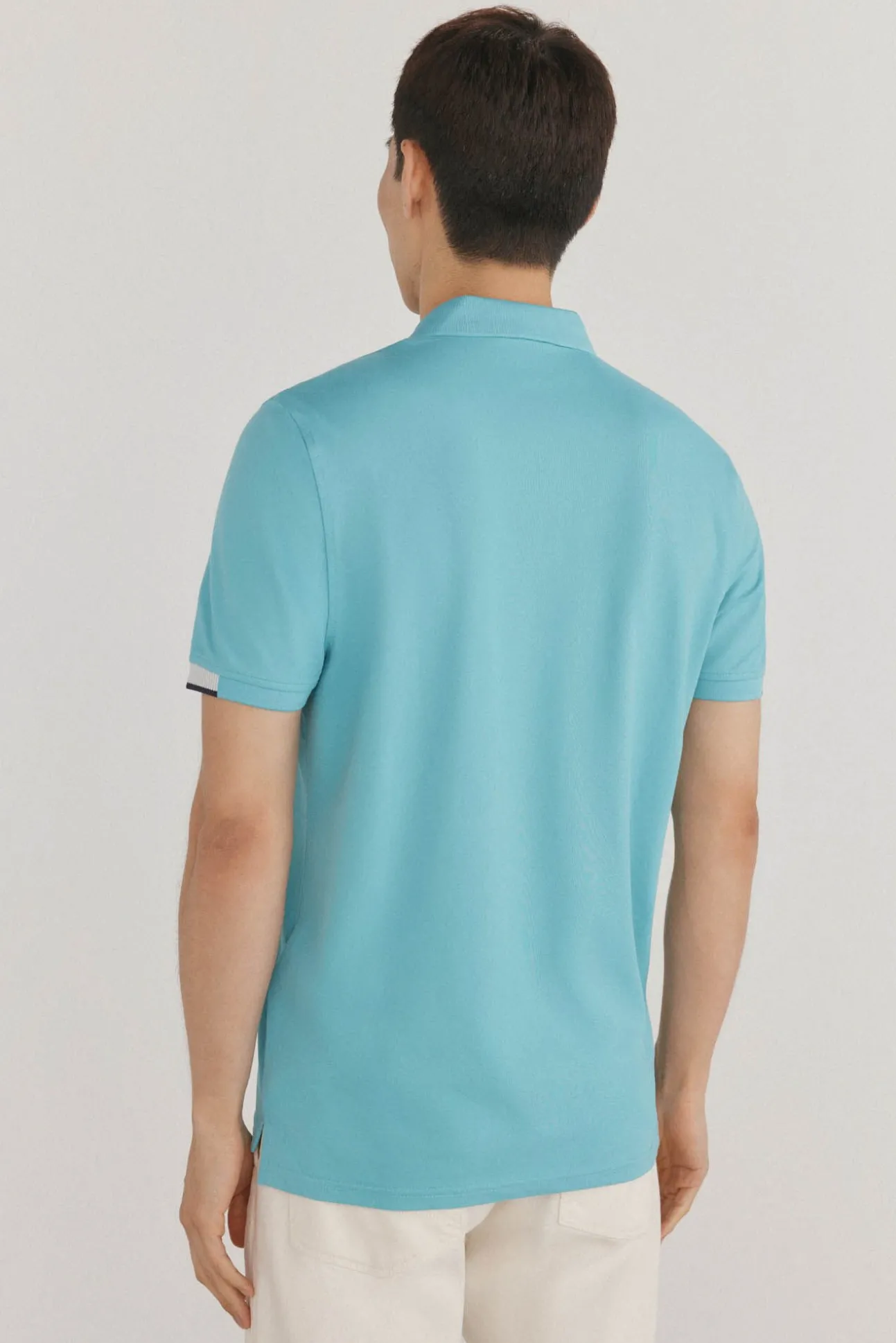 Polo puños contraste