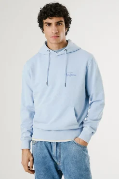 Sudadera lavada con logo pequeño frontal y logo grande en la espalda.